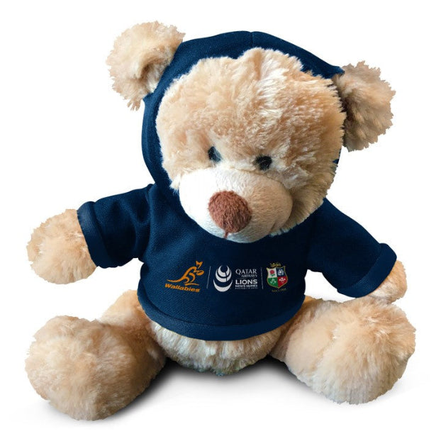 A plush teddy bear wearing a hoodie with the British & Irish Lions logo.