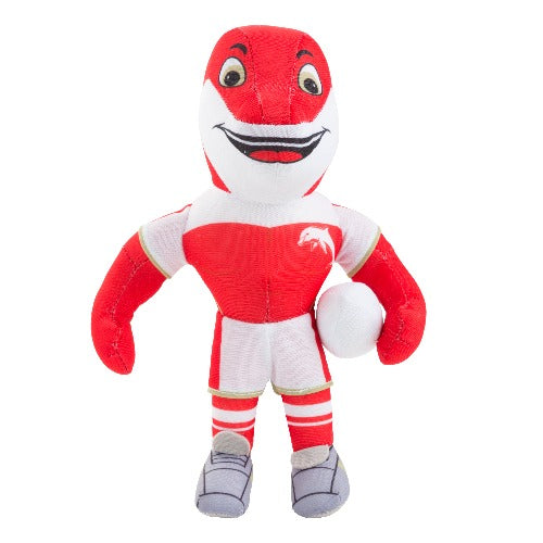 A plush toy representing a dolphin mascot, dressed in a red and white sports uniform, holding a ball, standing upright.