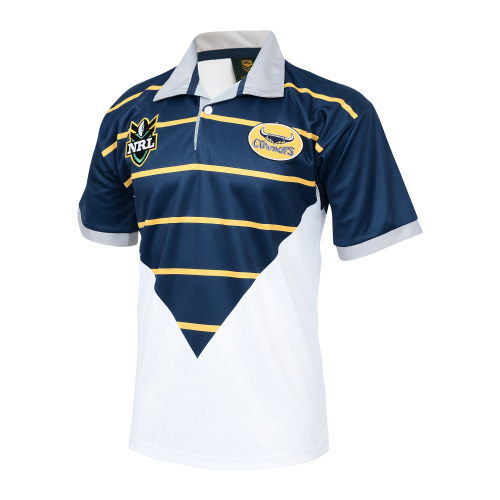 A North Queensland Cowboys 1998 retro jersey featuring a geometric pattern in navy blue, white, and gold colors with a team logo and sponsor's name on the front.