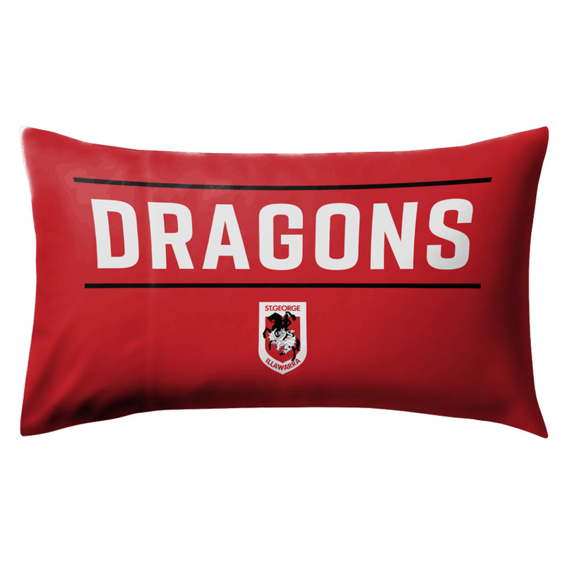 Red pillow with 'DRAGONS' text and logo