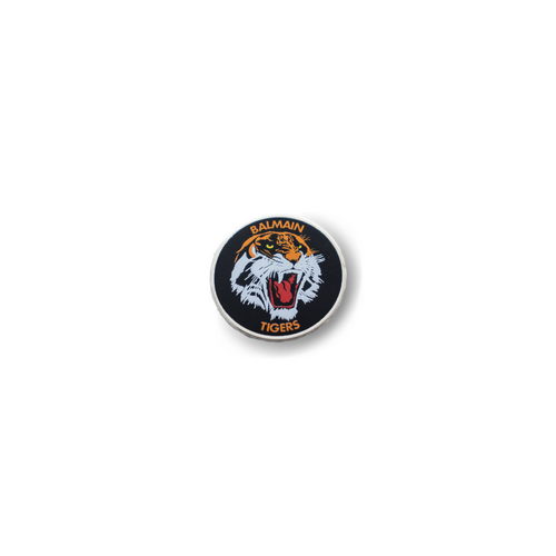 A metal pin with the Balmain Tigers logo