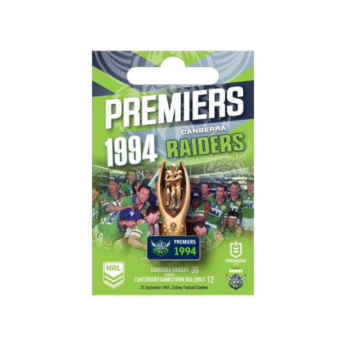 A collectible pin featuring the Canberra Raiders 1994 Premiers branding and a 3D trophy design, packaged on a green and white card.