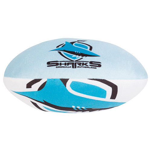 A plush toy resembling a football with geometric patterns in blue and white colors, and the text 'SHARKS' on it.