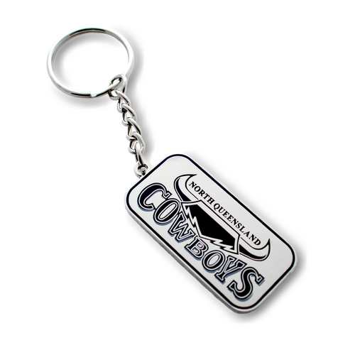A metal keyring with the North Queensland Cowboys branding, featuring a silver color and the team's logo.