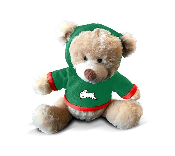 A plush teddy bear wearing a green hoodie with a South Sydney Rabbitohs logo on the front.
