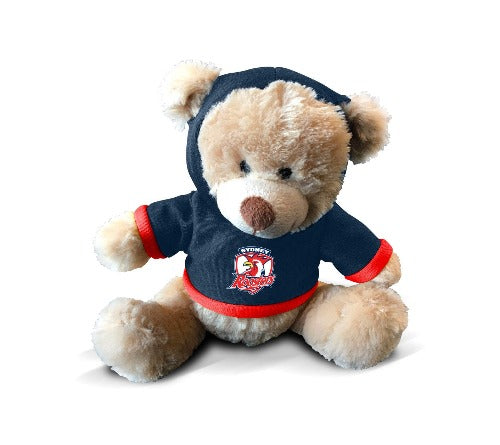A plush teddy bear wearing a blue hoodie with the Roosters logo on the front.